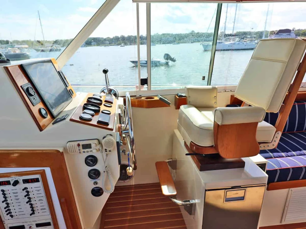 Image of REPETE, 2004 Bruckmann Bluestar 37, side view of helm station to starboard.
