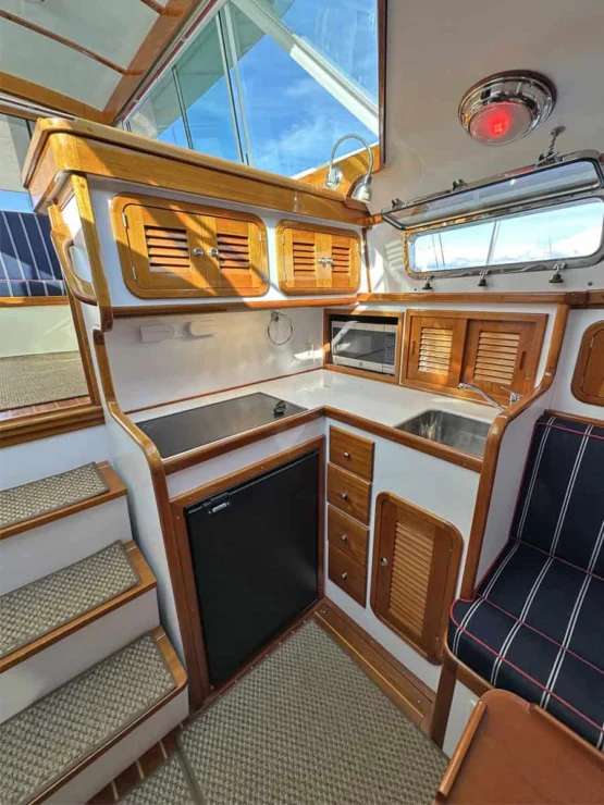Image of REPETE, 2004 Bruckmann Bluestar 37, view of galley outboard to port.