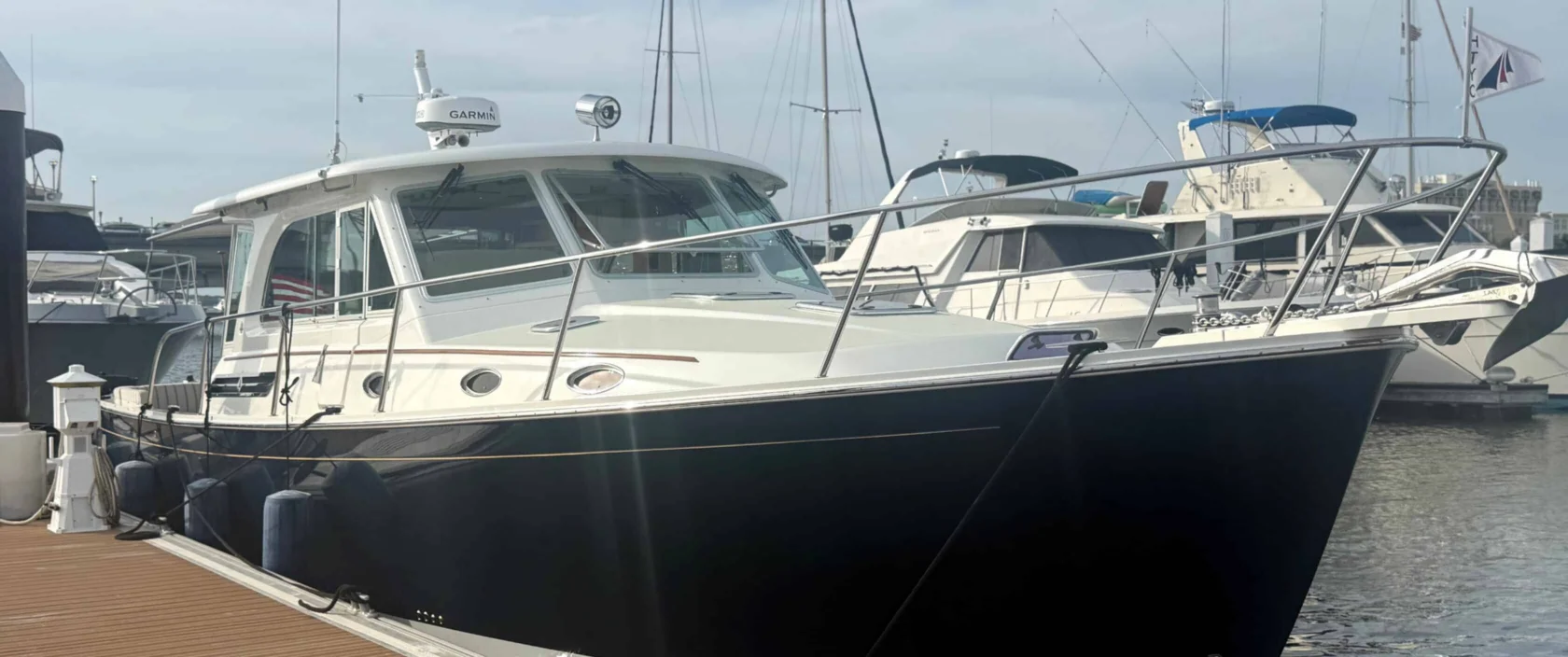 2018 Back Cove 41 Downeast yacht Sea Sturgeon with a dark blue hull docked at a marina