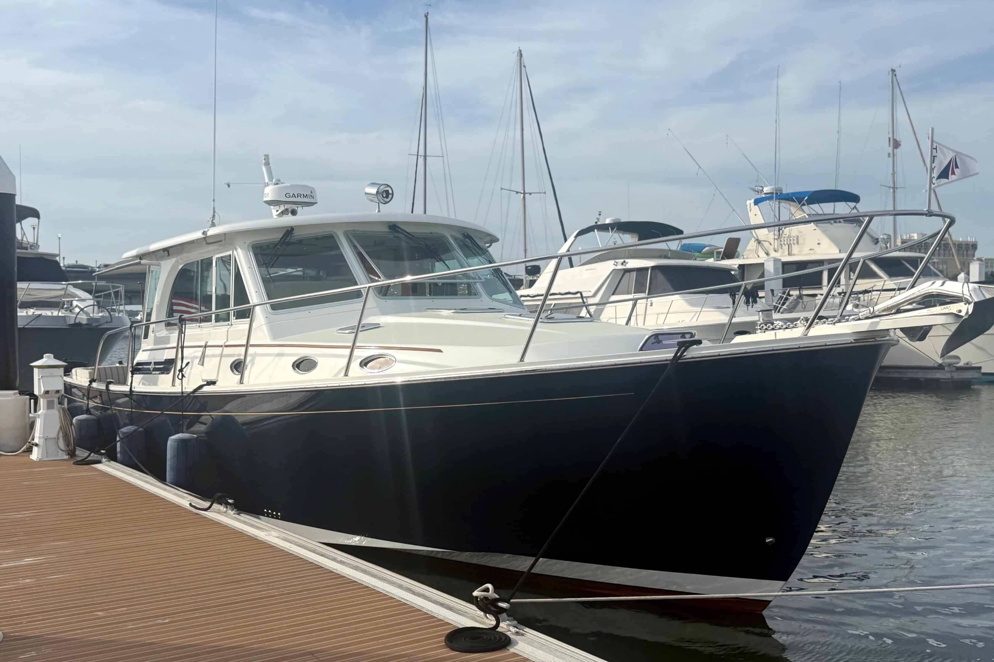 2018 Back Cove 41 Downeast yacht Sea Sturgeon with a dark blue hull docked at a marina