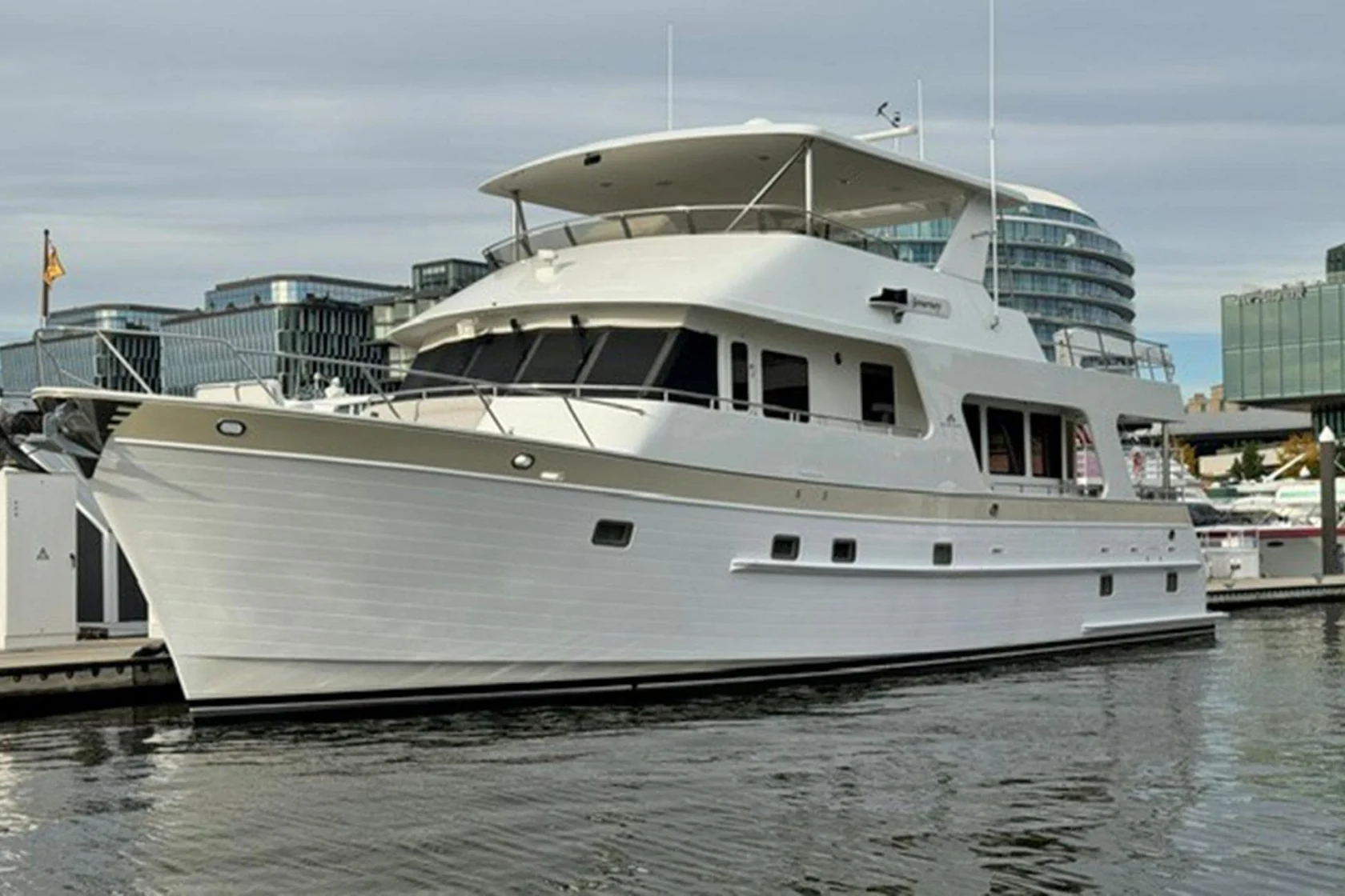 2008 Outer Reef 650 Motoryacht Journey cruising on the water, showing its profile view and classic raised pilothouse design