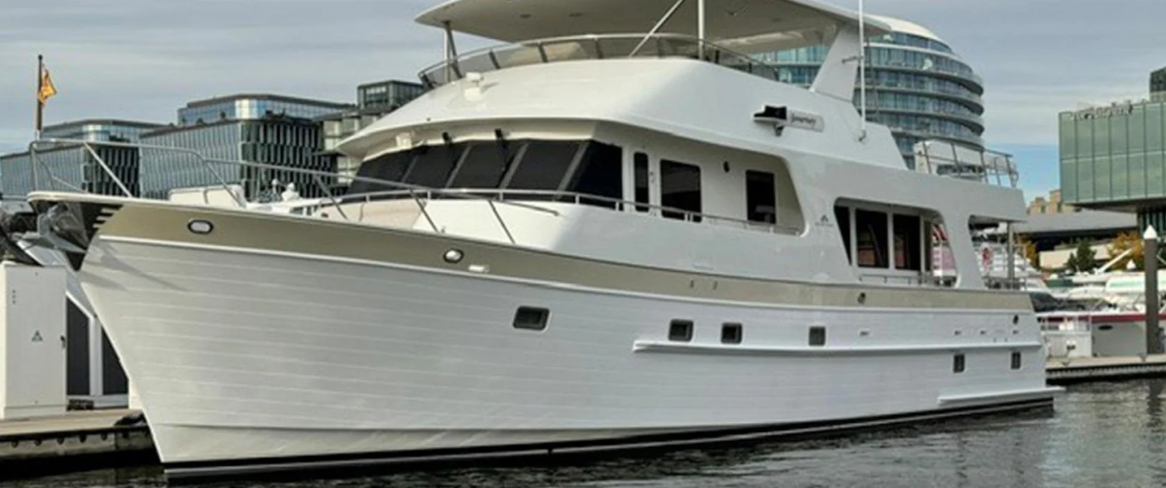 2008 Outer Reef 650 Motoryacht Journey cruising on the water, showing its profile view and classic raised pilothouse design