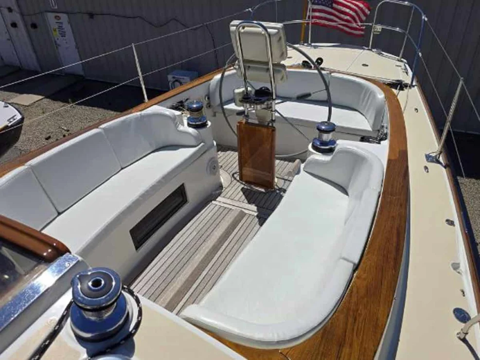 Ergonomic cockpit layout of the Alerion 41 sailboat "Sudan," looking aft toward the helm pedestal and stern.
