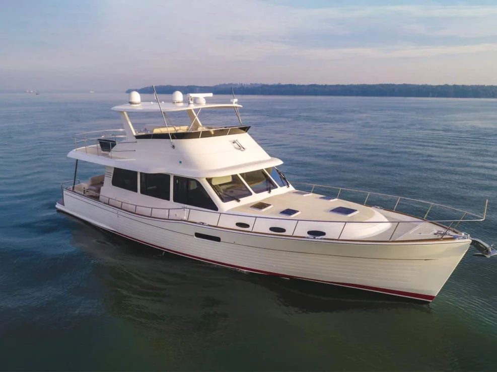 Aerial bow view of the Grand Banks 60 motor yacht SOUTHERLY underway on calm water