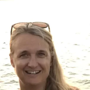 Carolyn, yacht broker for Wellington Yacht Partners in Portsmouth, Rhode Island, pictured by the water.
