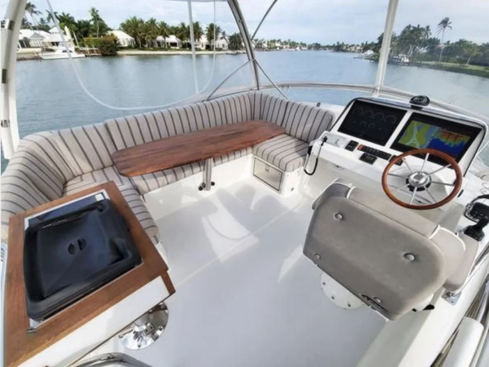 2018 Sabre 48 Flybridge Defy Gravity, flybridge settee and table.
