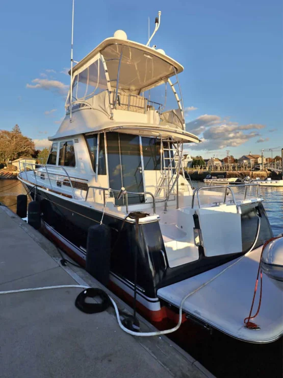 2018 Sabre 48 Flybridge Defy Gravity, port quarter at dock.