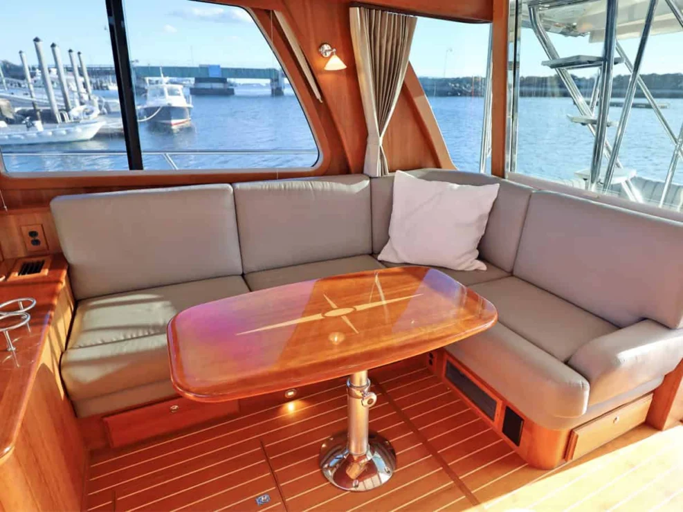 2018 Sabre 48 Flybridge Defy Gravity, salon settee and table.