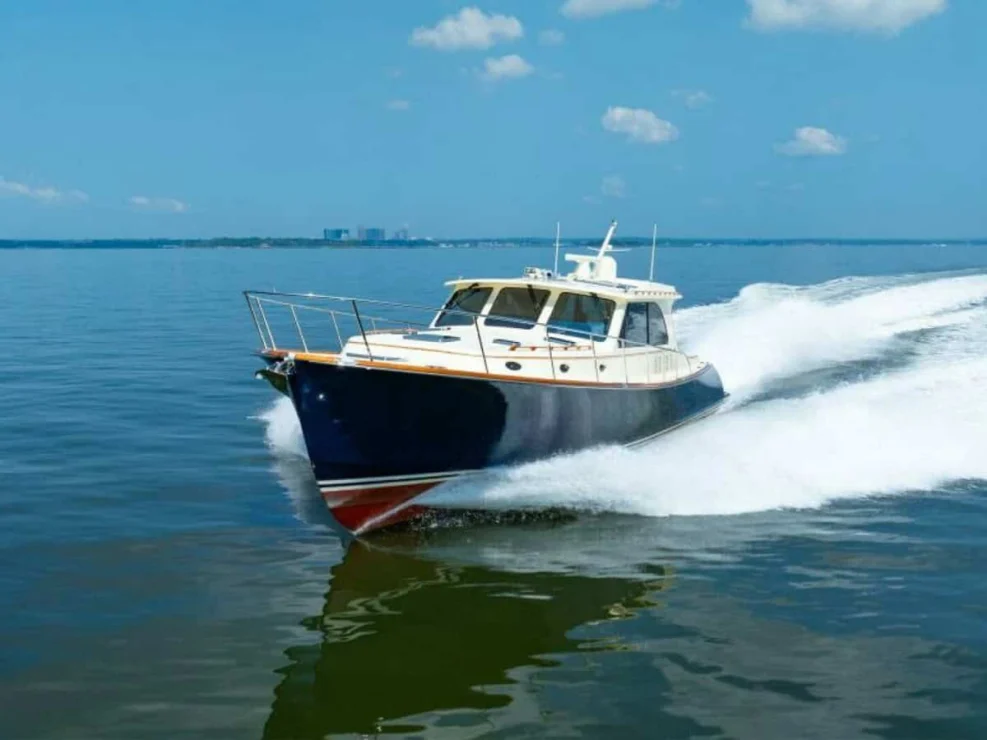 2012 Hinckley Talaria 48 "Concerto In Sea" bow view slicing through water.