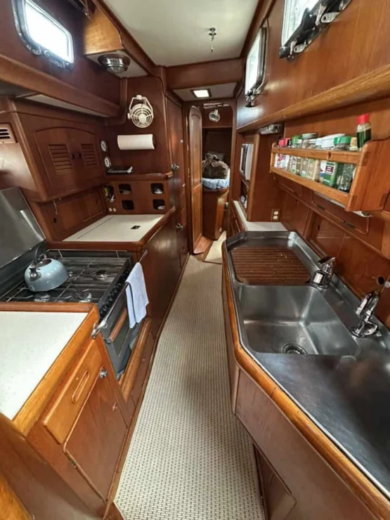 Little Harbor 53 view of galley looking aft with counters and storage.