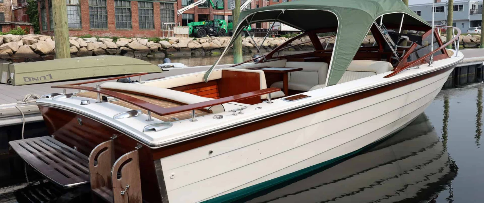 1990 Windsor Craft 26 Picnic Boat, starboard side quarter view at the dock.