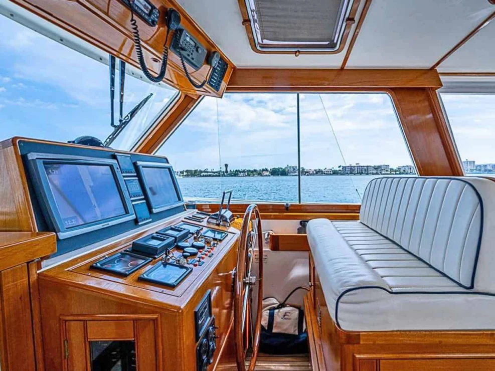 2001 Grand Banks Eastbay 46 Sweet helm station outboard with opening starboard window and double helm seat.