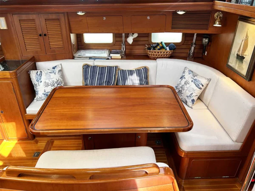 1994 Little Harbor 60 for sale - main salon settee and open table to port.