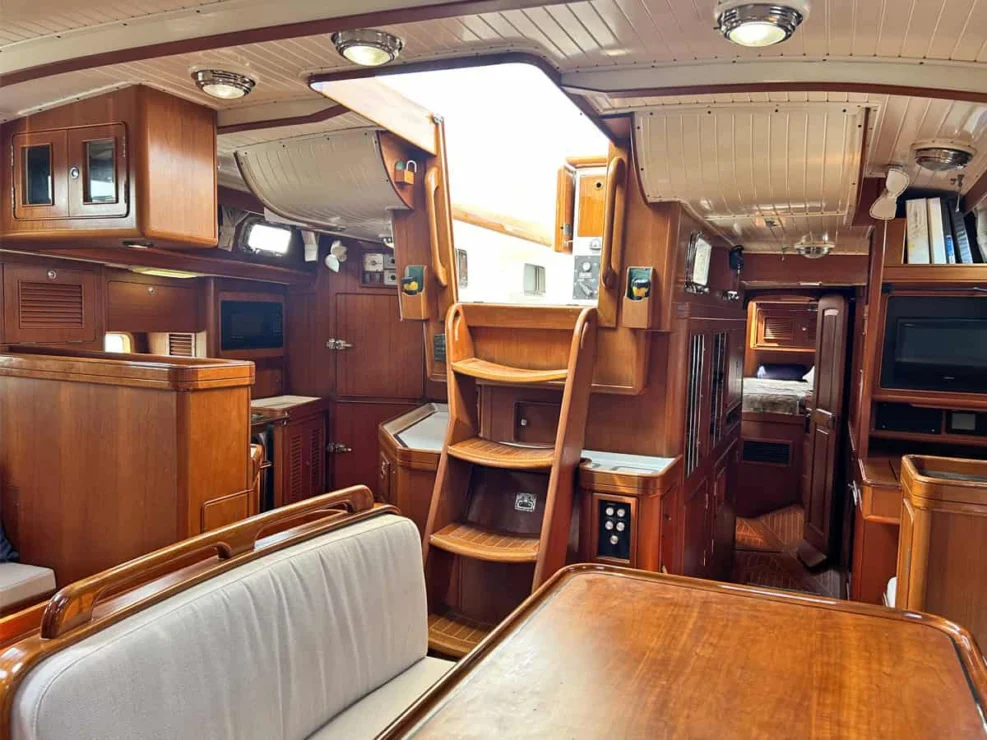 1994 Little Harbor 60 for sale - main salon aft with view of companionway, nav area and galley.