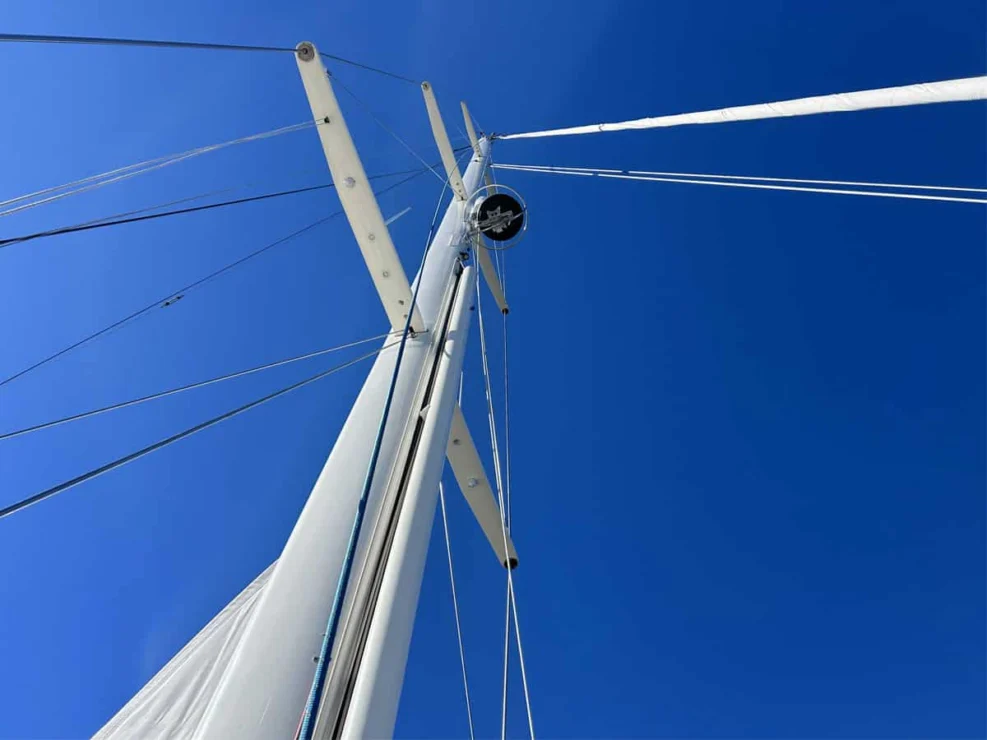 Lyman Morse 63 for sale, rig against blue sky
