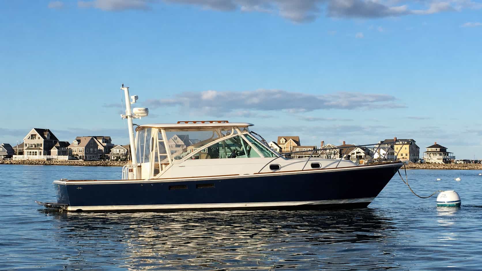 2003 Hunt Yachts Harrier 36, starboard profile view on the water.