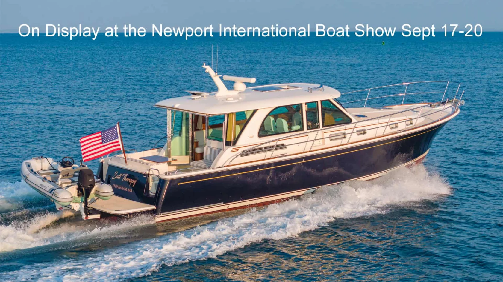 Sabre 45 Salon Express Salt Therapy cruising on the water with boat show message.