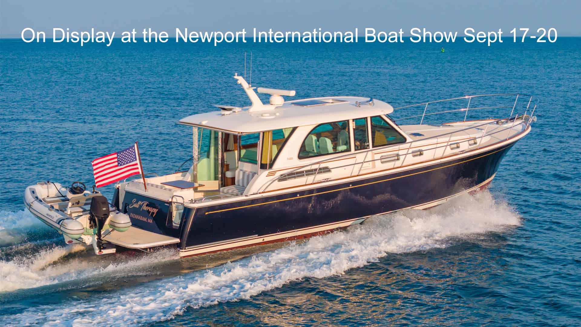 Sabre 45 Salon Express Salt Therapy cruising on the water with boat show message.