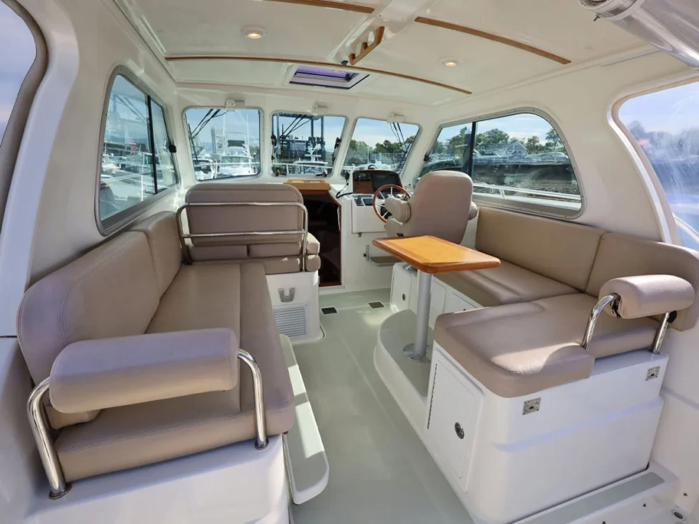 Image of 2016 Back Cove 30 REVERIE with view of pilothouse interior looking forward.