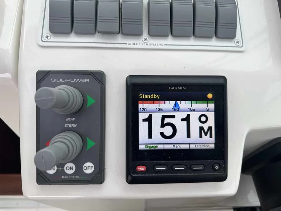 Image of 2016 Back Cove 30 REVERIE with view of thrusters and autopilot at helm.