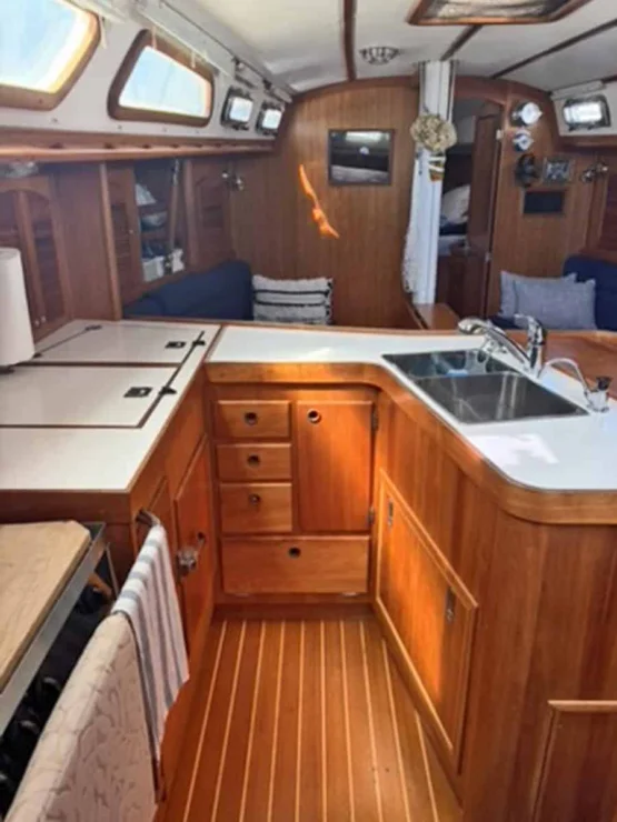 2002 Sabre 402, galley looking forward with sink and storage.