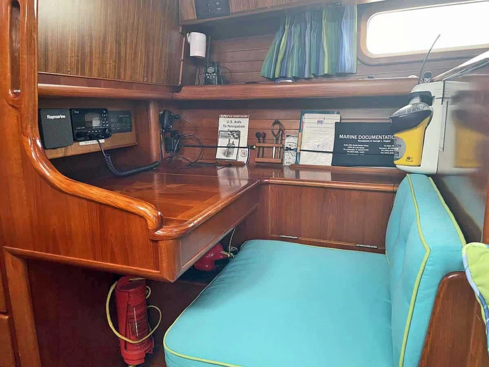 1990 Little Harbor 46 for sale, showing image of the navigation area with bench, desk and instruments.