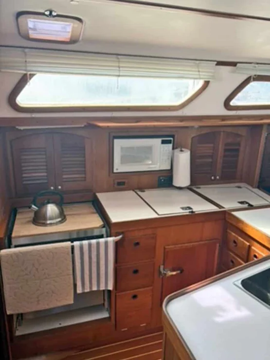 2002 Sabre 402, galley to port with sink and storage.