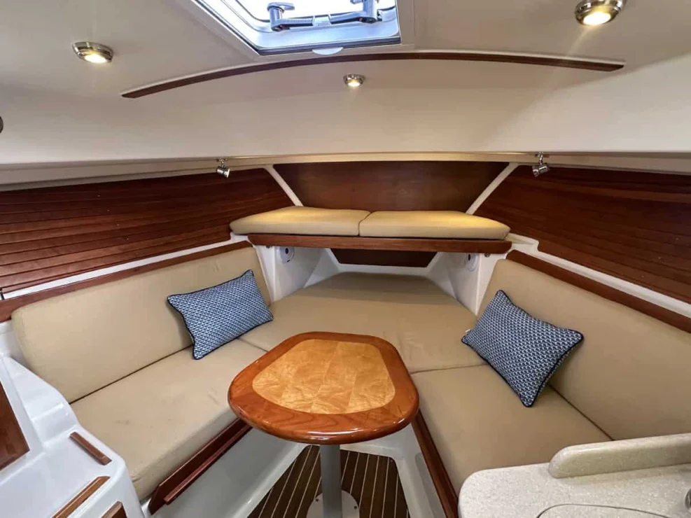 Image of 2016 Back Cove 30 REVERIE with view of convertible v-berth with table between.