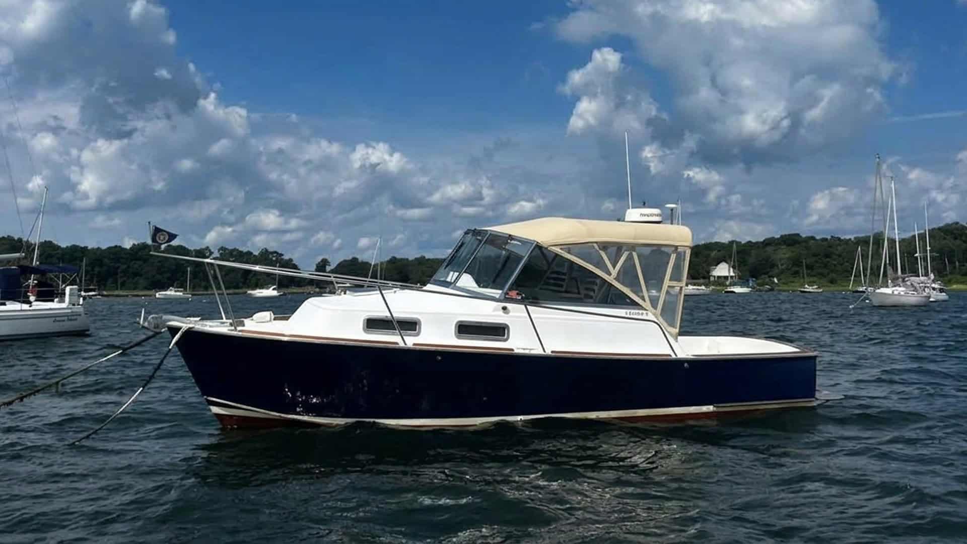 Legacy 28 Express port profile abeam on the water.
