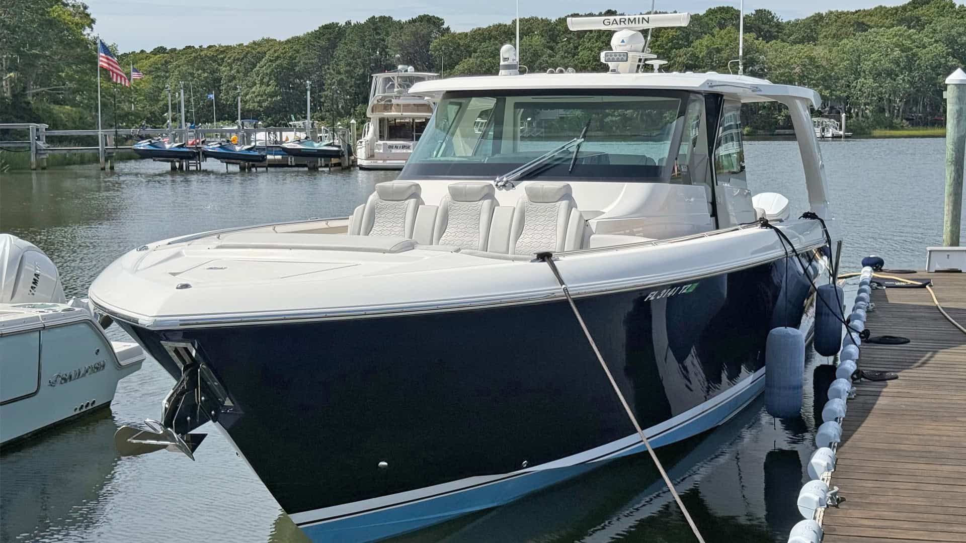 2022 Tiara 48LS, port bow at dock.