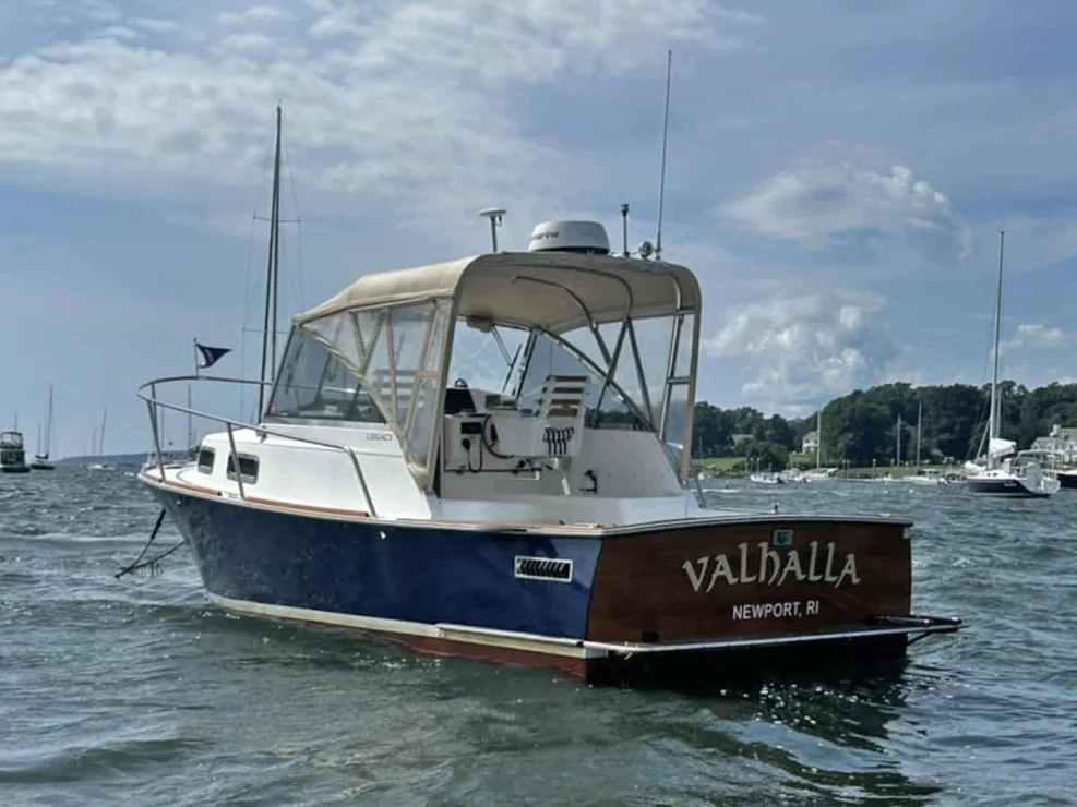 2000 Legacy 28 Express port stern view on the water.