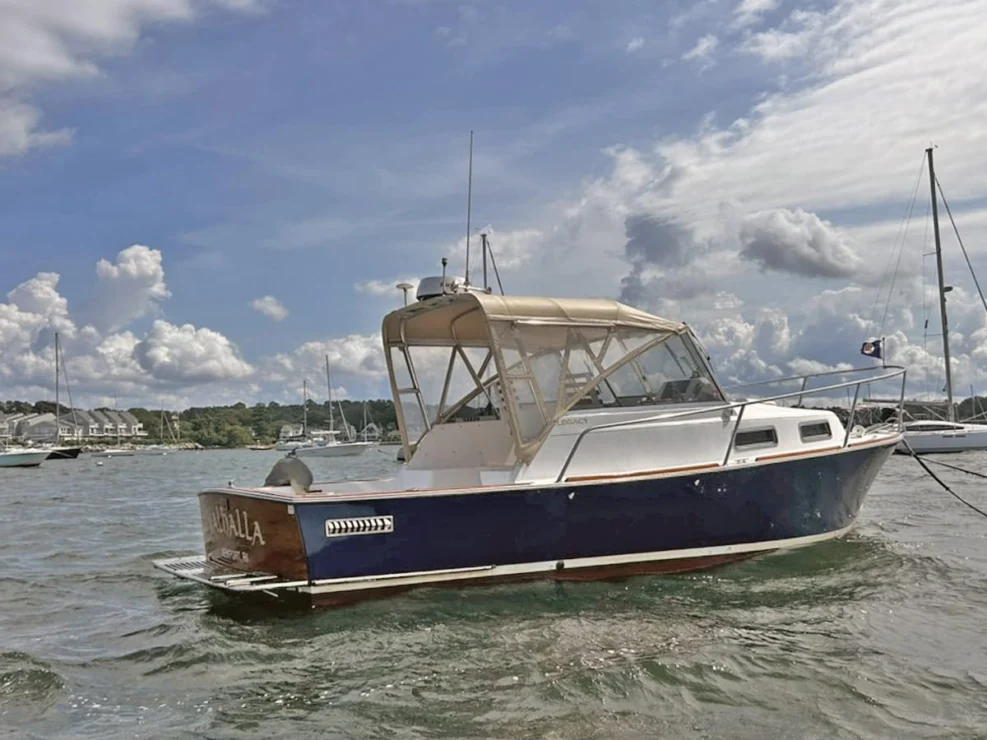 2000 Legacy 28 Express aft starboard quarter on the water.