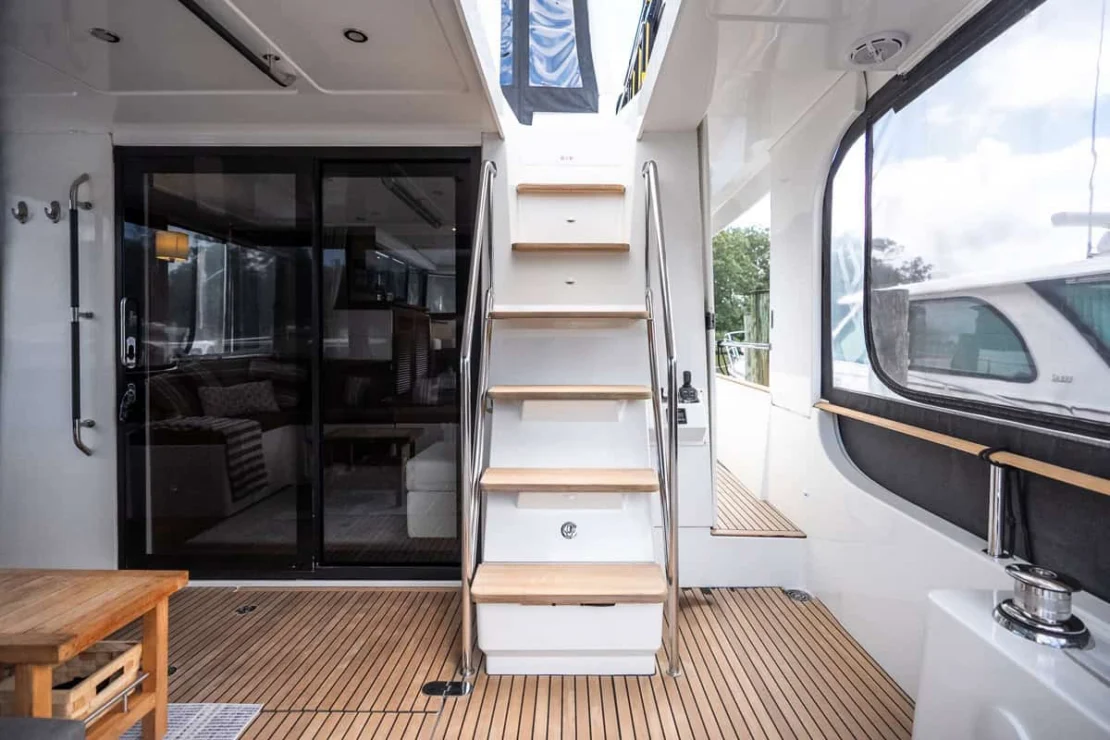 Beneteau Oceanis Swift Trawler 50 steps from lanai to flybridge.