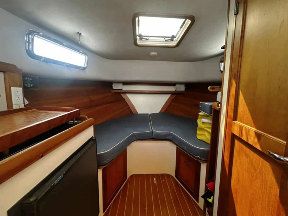 2000 Legacy 28 Express interior with v-berth and storage.