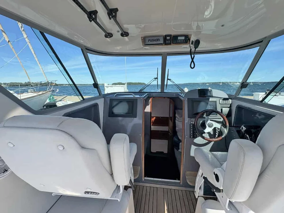 2011 Protector Tauranga 41 helm area with helm and companion seating.
