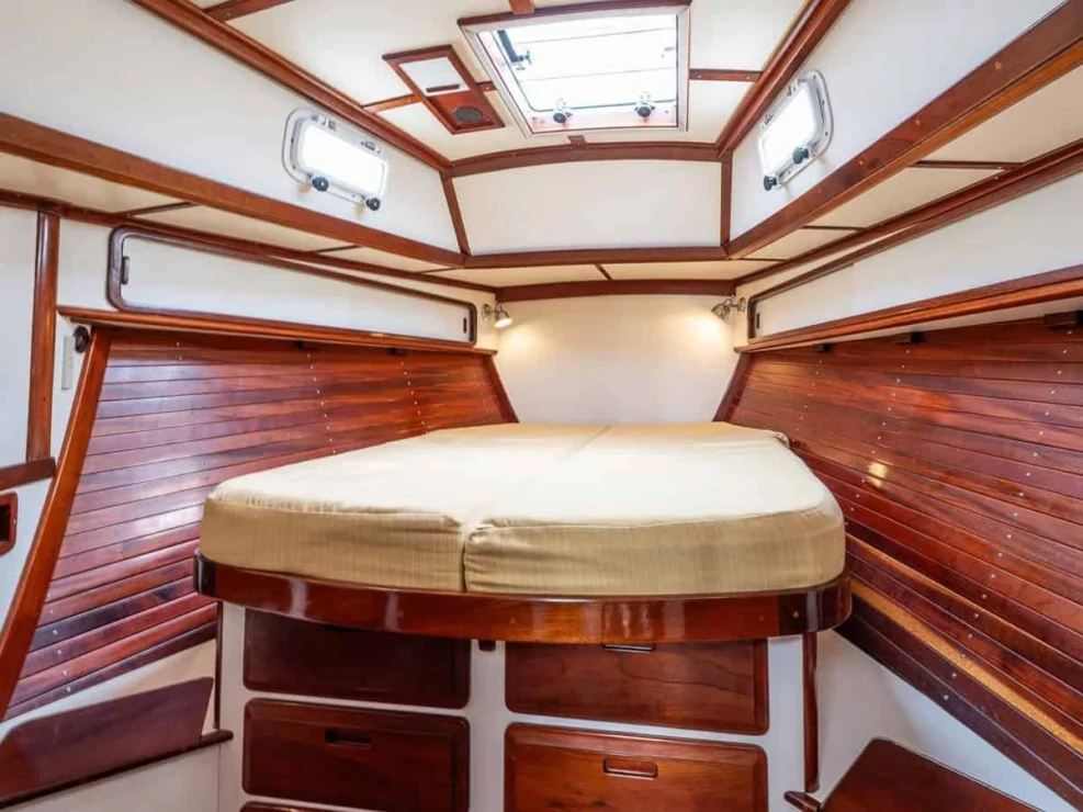 1983 Morris Ocean Series 44 forward berth with storage beneath.