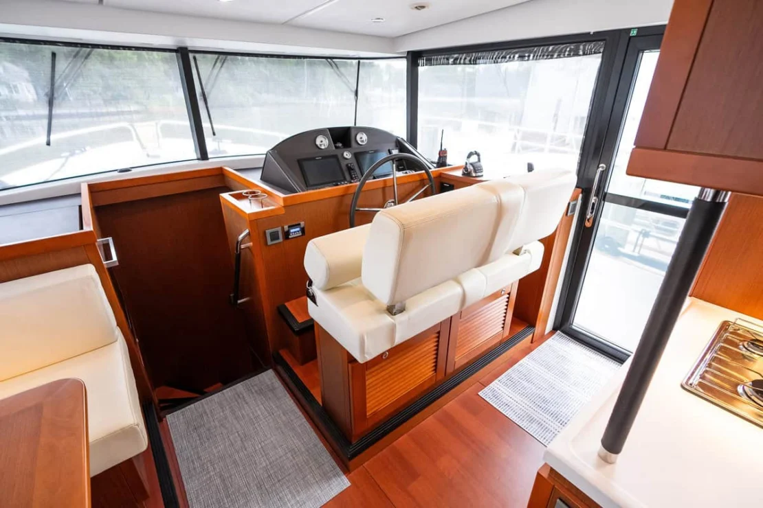 Beneteau Oceanis Swift Trawler 50 helm station to starboard.