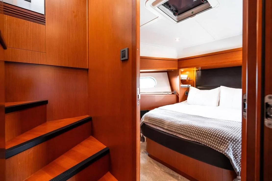 Beneteau Oceanis Swift Trawler 50 companionway steps to guest cabin.