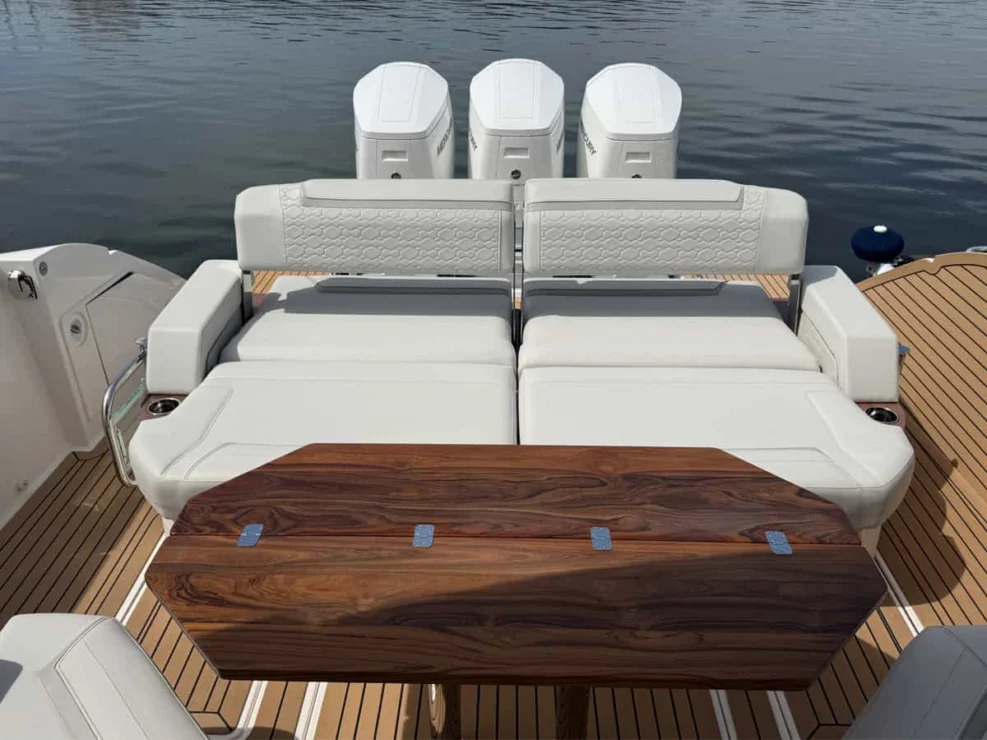 2022 Tiara 48LS, cockpit seating and table.